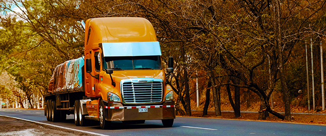 CDL-A truck driver starting a long haul career with flatbed trailer