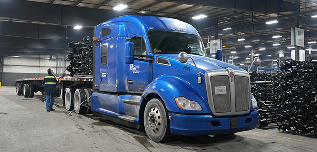 Flatbed truck transporting open-deck freight for experienced CDL-A drivers