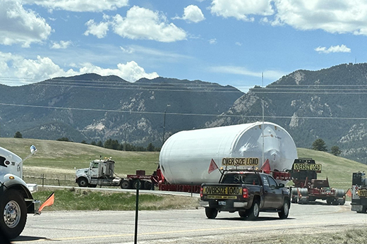 Experienced driver operating heavy haul trailer on highway