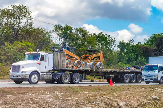 Flatbed truck hauling secured construction materials