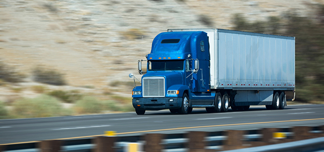 semi truck traveling cross-country freight route