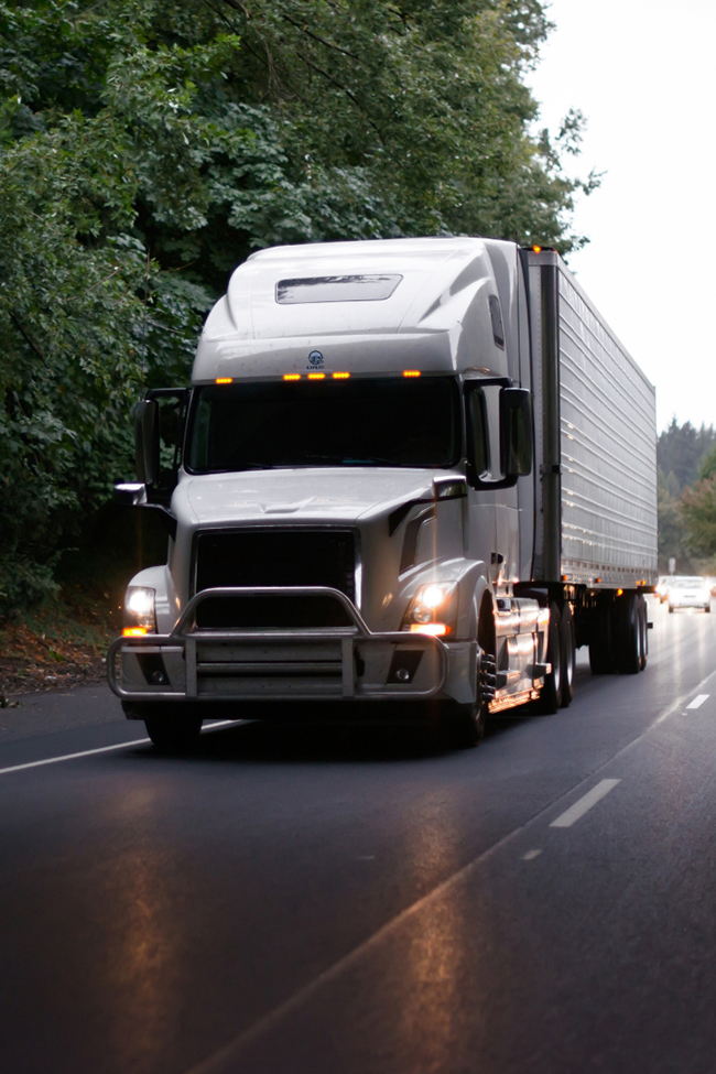 semi trucks transporting freight across interstate highway