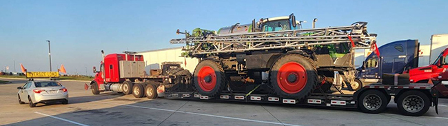 heavy haul flatbed truck transporting industrial equipment