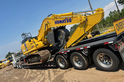 RGN trailer carrying heavy machinery
