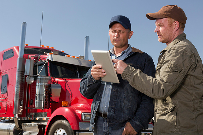 CDL-A driver reviewing trucking pay rates
